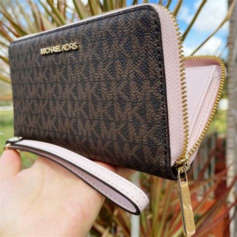 michael michael kors wristlet|Michael Kors wallet with strap.